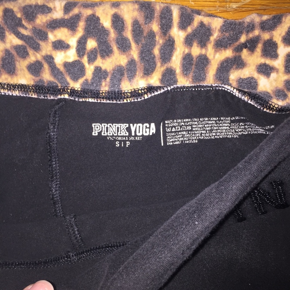pink yoga pants folder over waist cheeta print